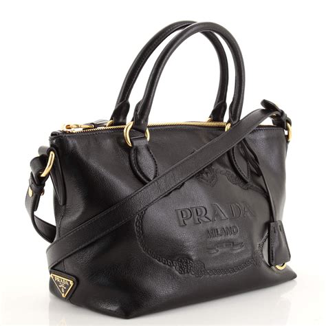 prada embossed logo tote.